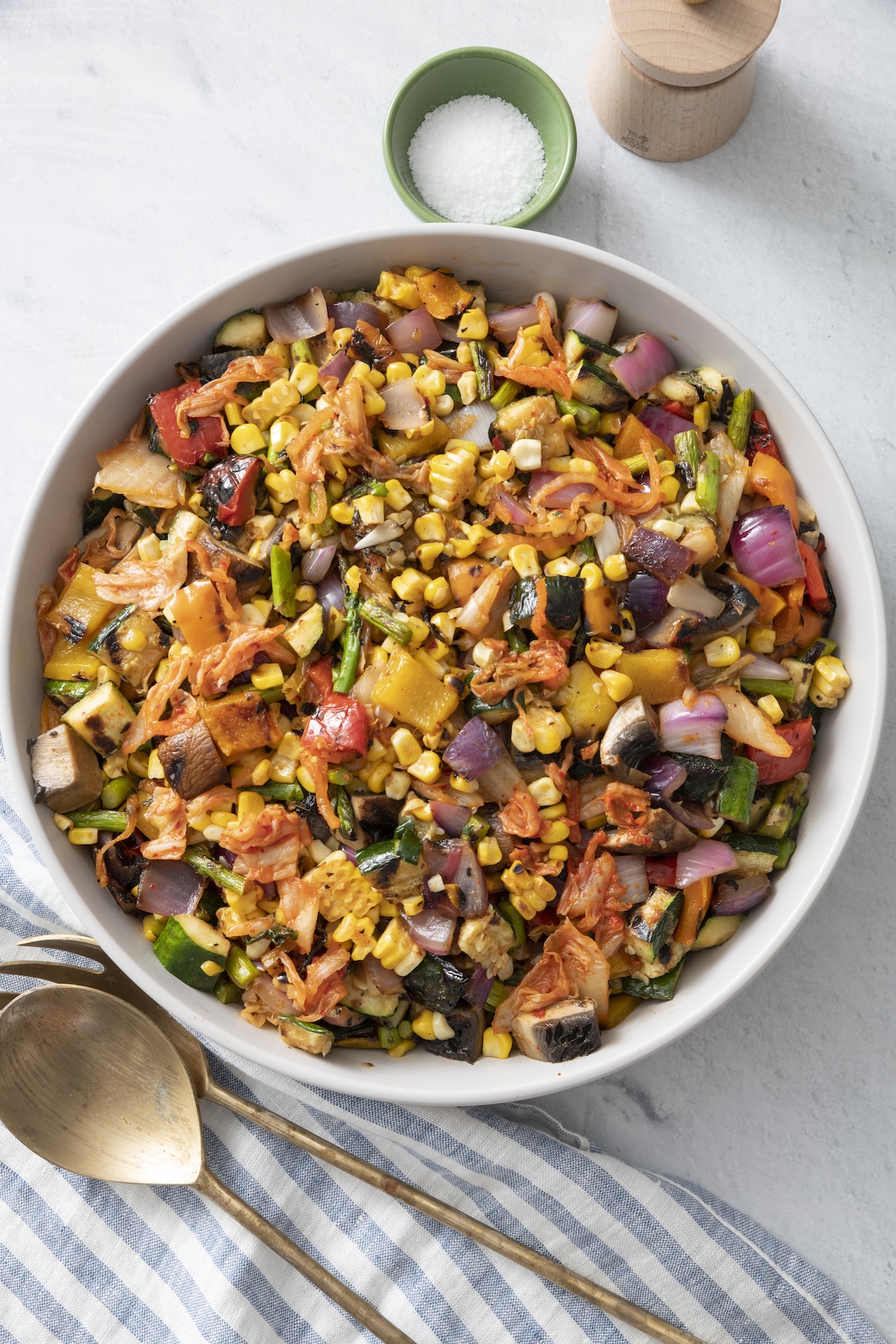 Grilled vegetable kimchi salad in a serving bowl.