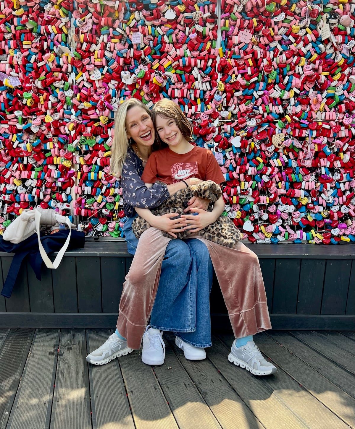 Gemma and Catherine in front of colorful wall.