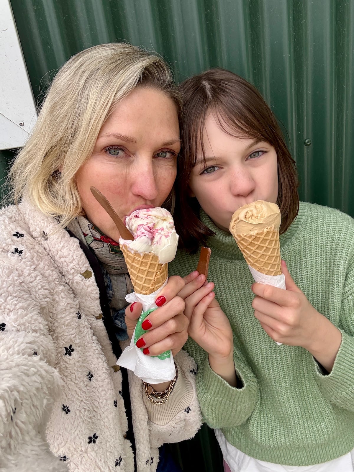 Mother and daughter eating ice cream.