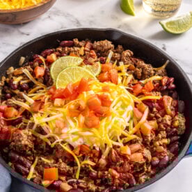 Skillet beef chili with toppings.