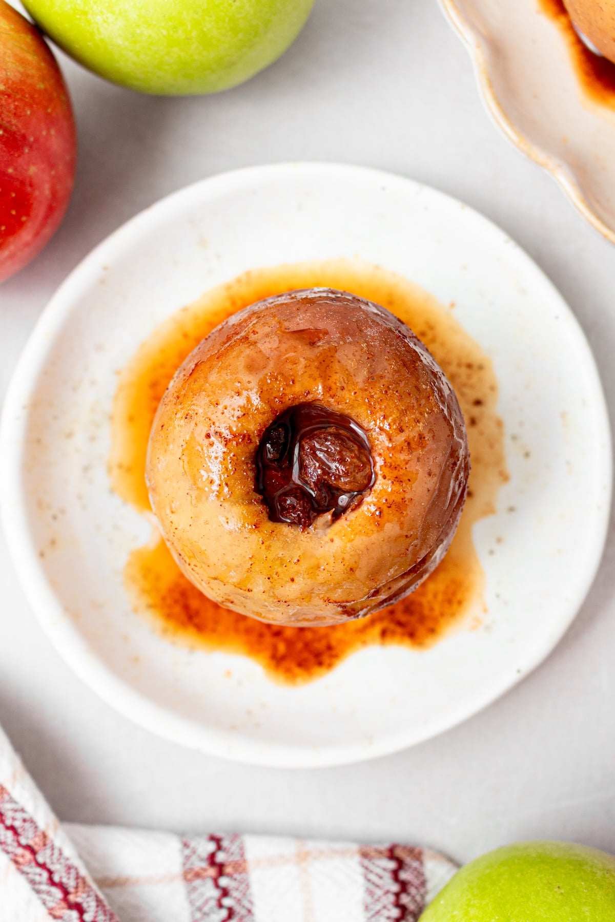 Baked apple on a serving plate.