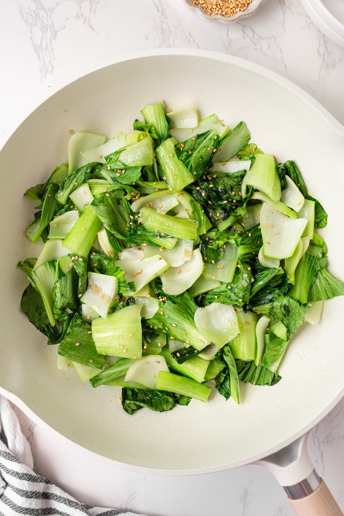 Sauteed bok choy in a pan.