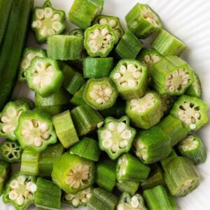 Pieces of steamed okra on a plate.