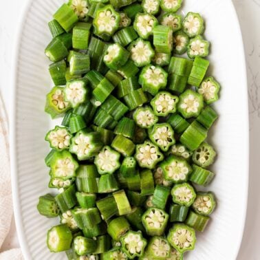 Steamed okra pieces on a plate.