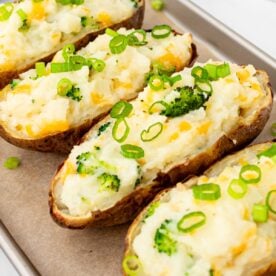 Twice baked potatoes on a baking sheet.