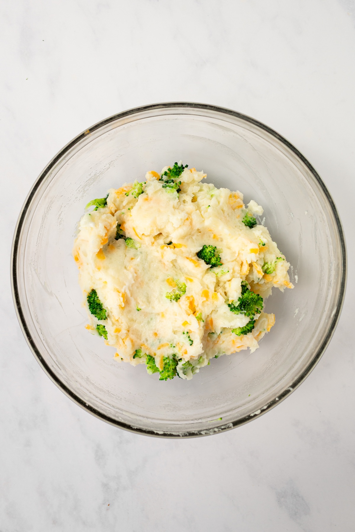 Twice baked potatoes filling in a mixing bowl.