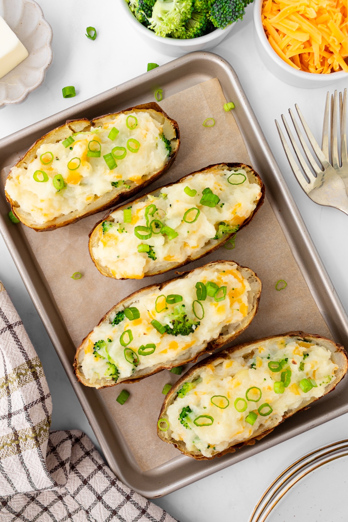 Twice baked potatoes on a baking sheet.
