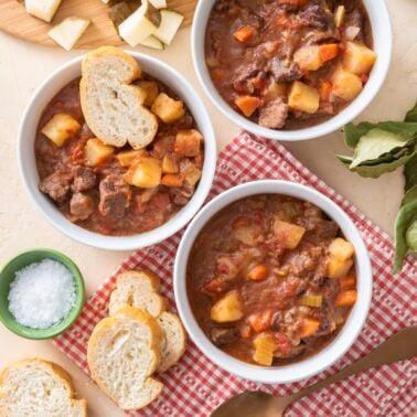 Three bowl of beef stew.