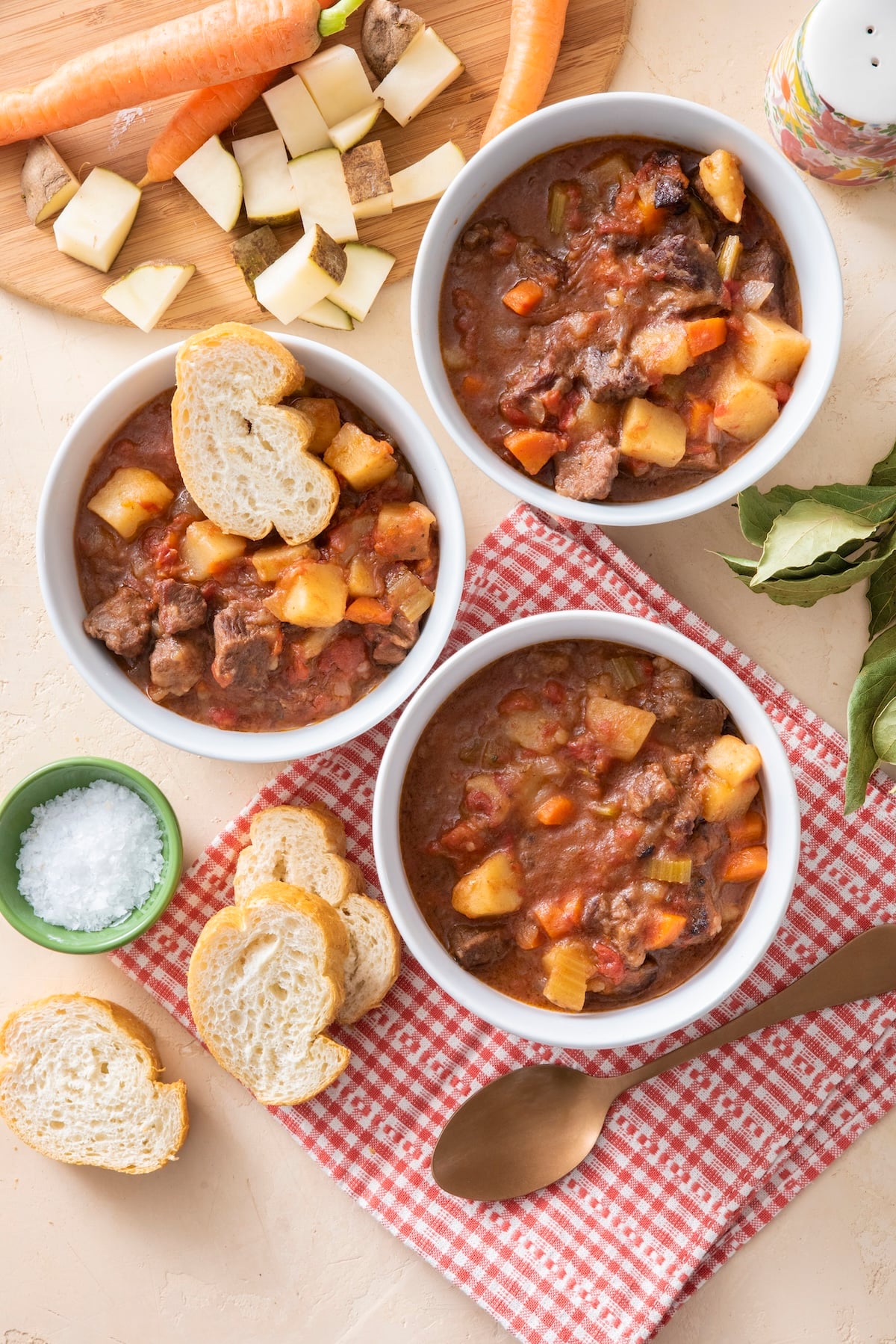 Three bowls of beef stew.