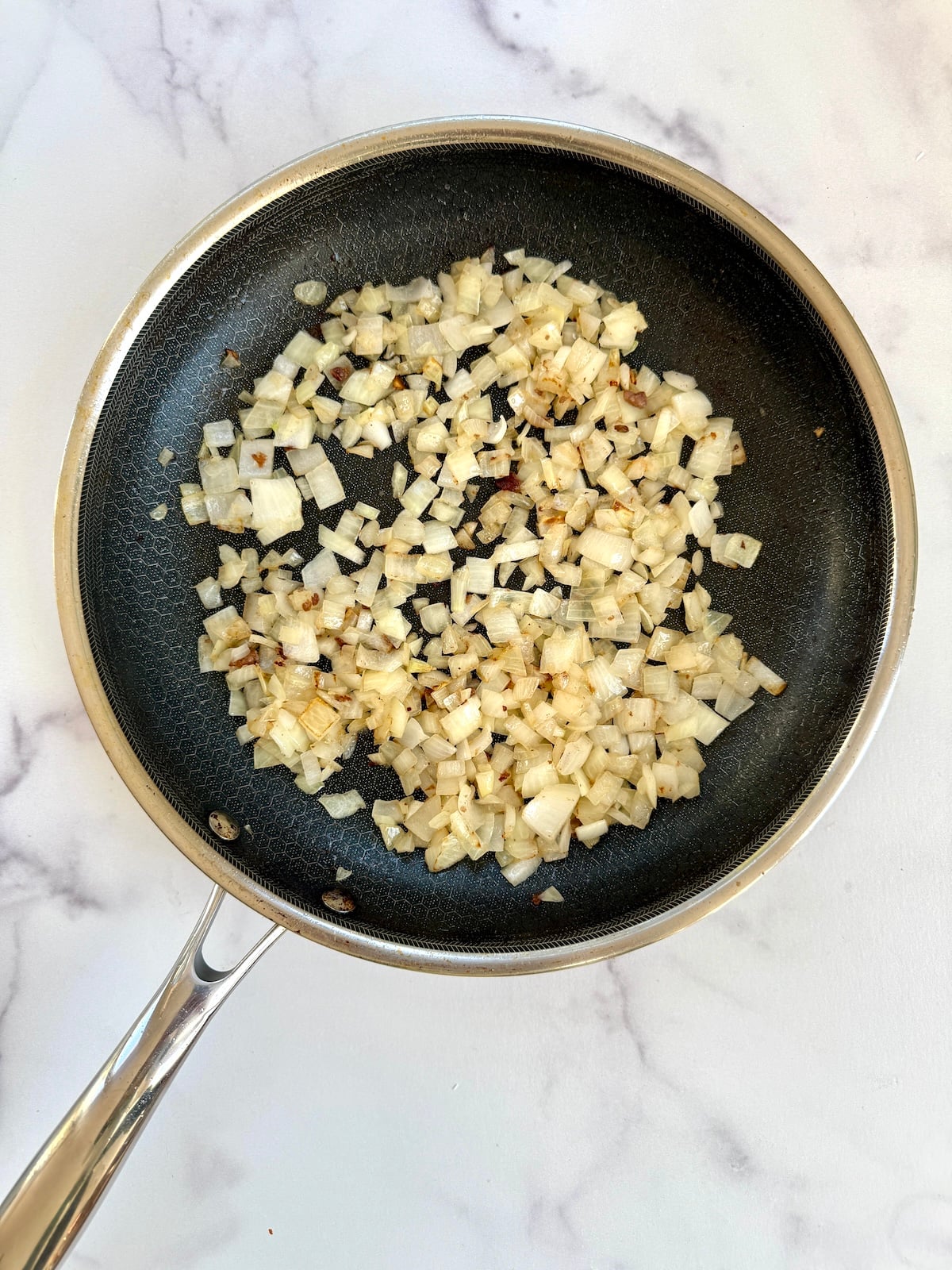 Sauteed onions and garlic in a pan.