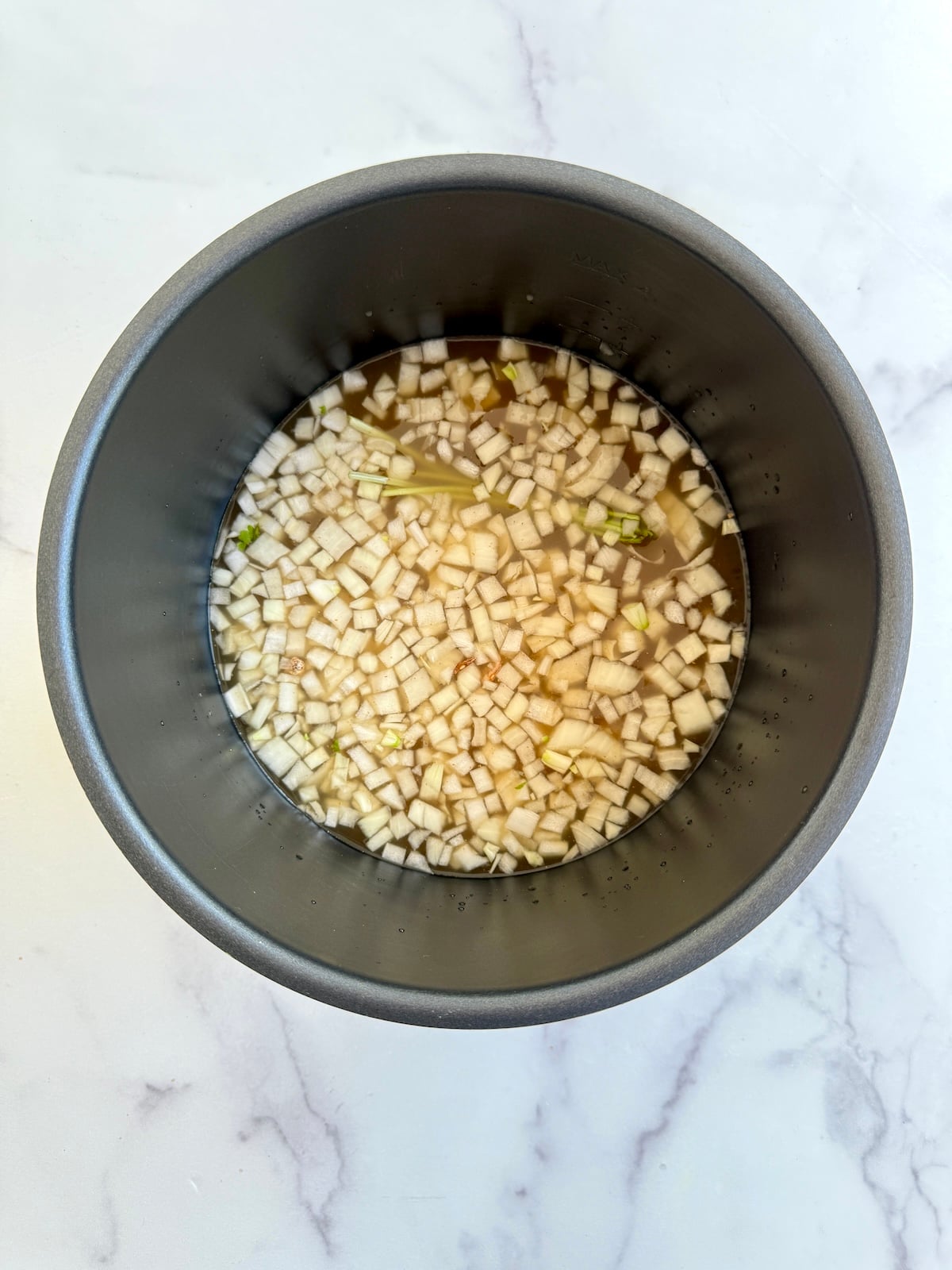Pinto beans in a pressure cooker.
