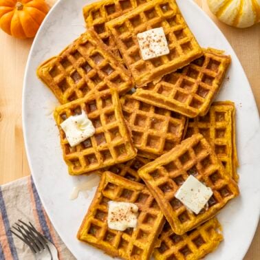Pumpkin waffles served on a platter.
