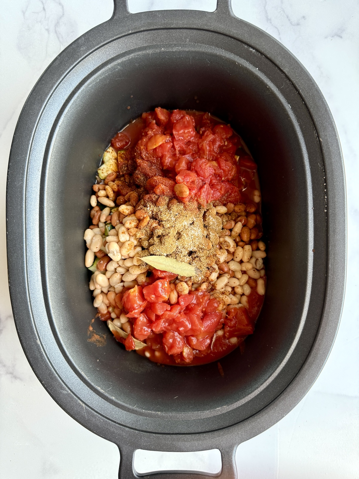 Slow cooker chicken chili ingredients in a crockpot.