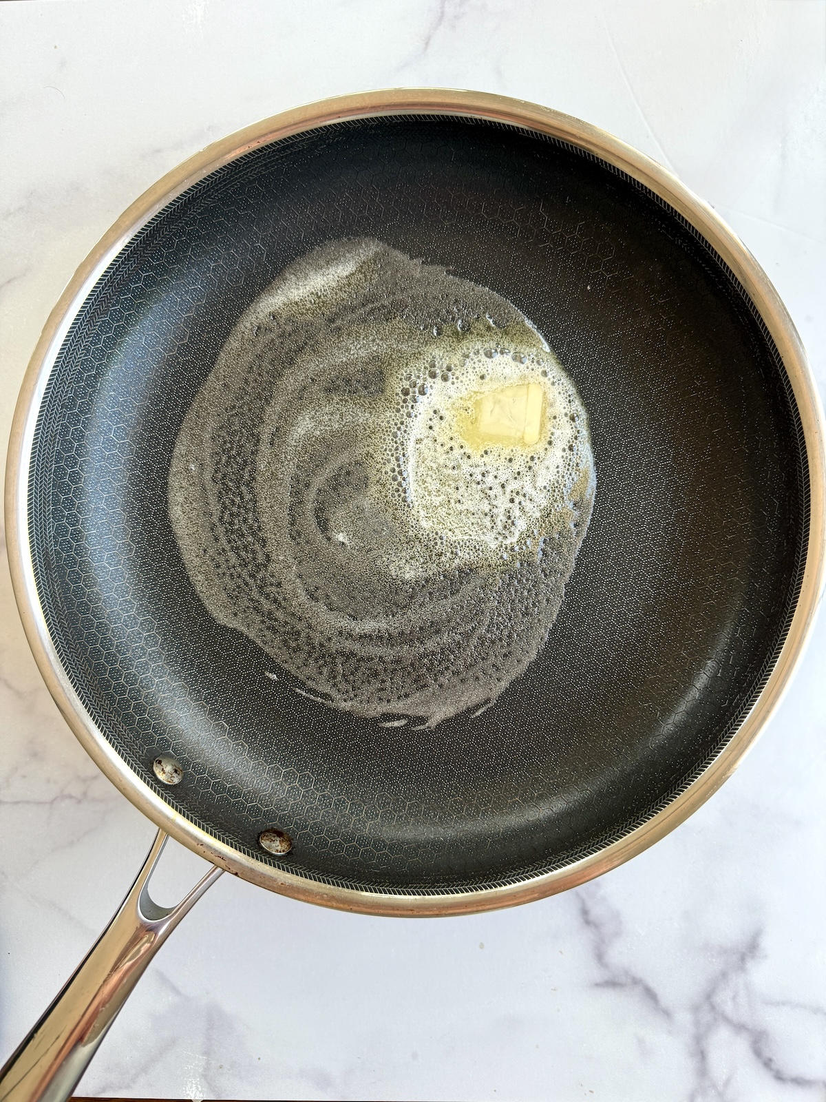 Butter melted in a pan.