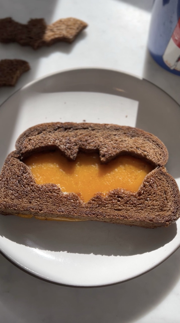 Spooky grilled cheese on a plate.