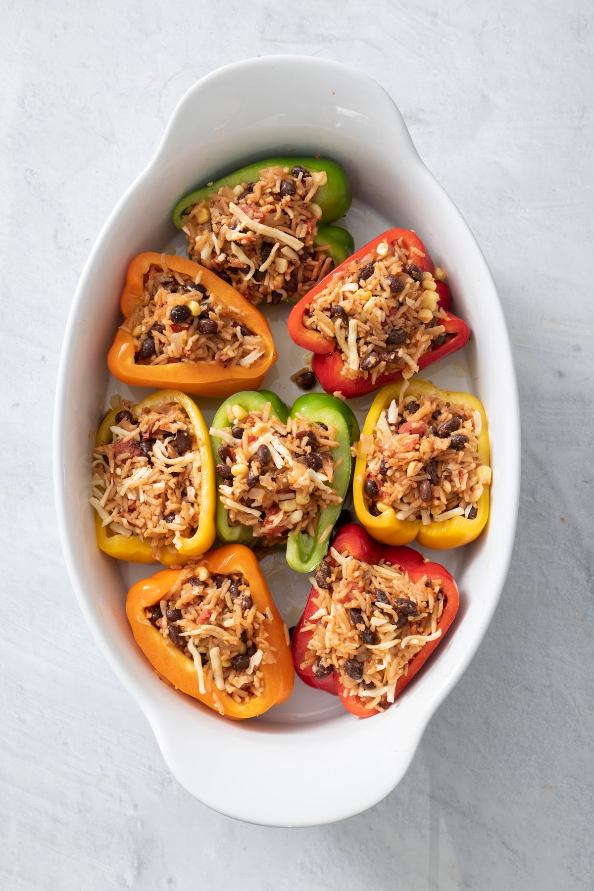 Bell peppers stuffed and ready to bake.