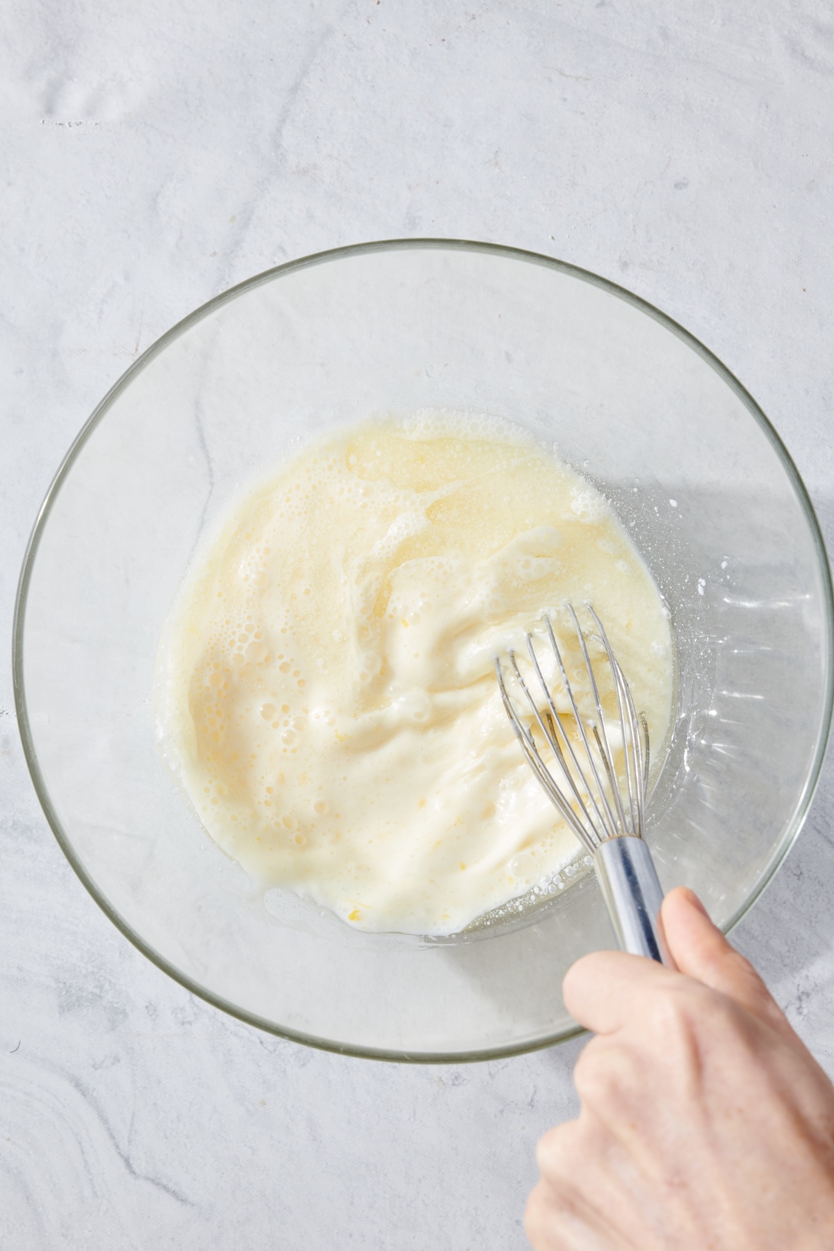 Wet ingredients for cornbread in a bowl.