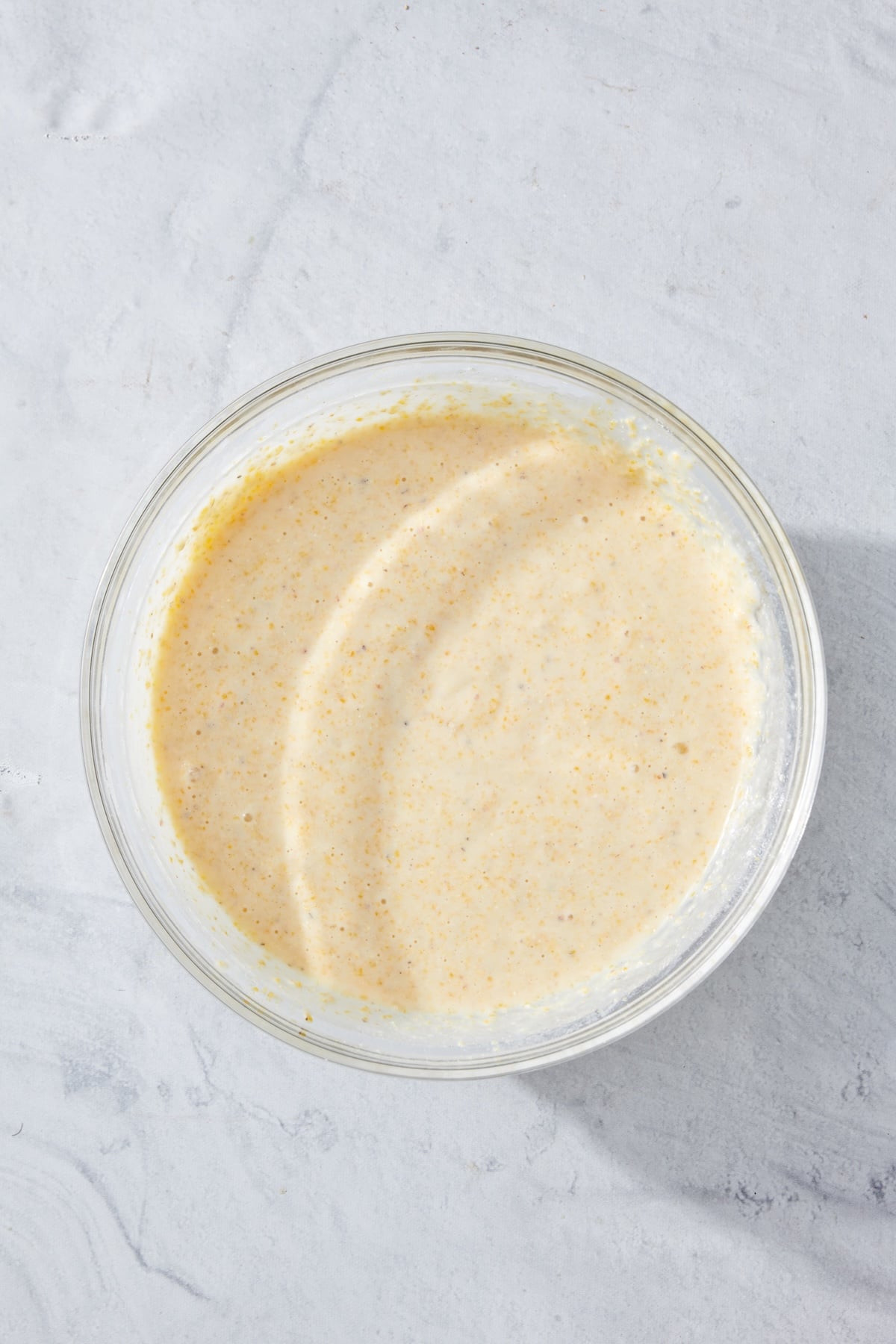Batter for cornbread in a mixing bowl.