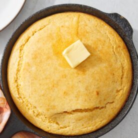 Basic cornbread recipe in a cast iron skillet.