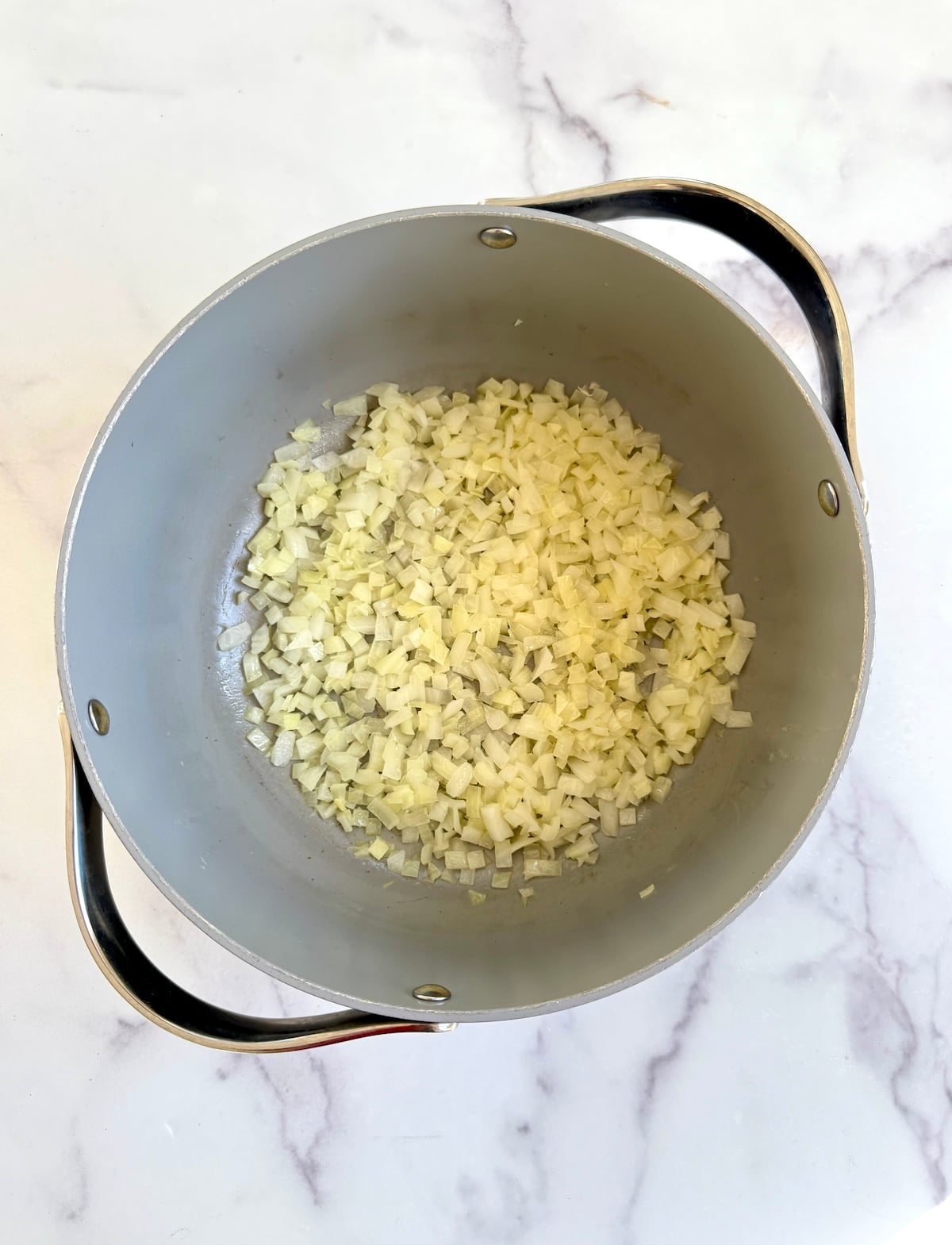 Sauteed onions in a pan.