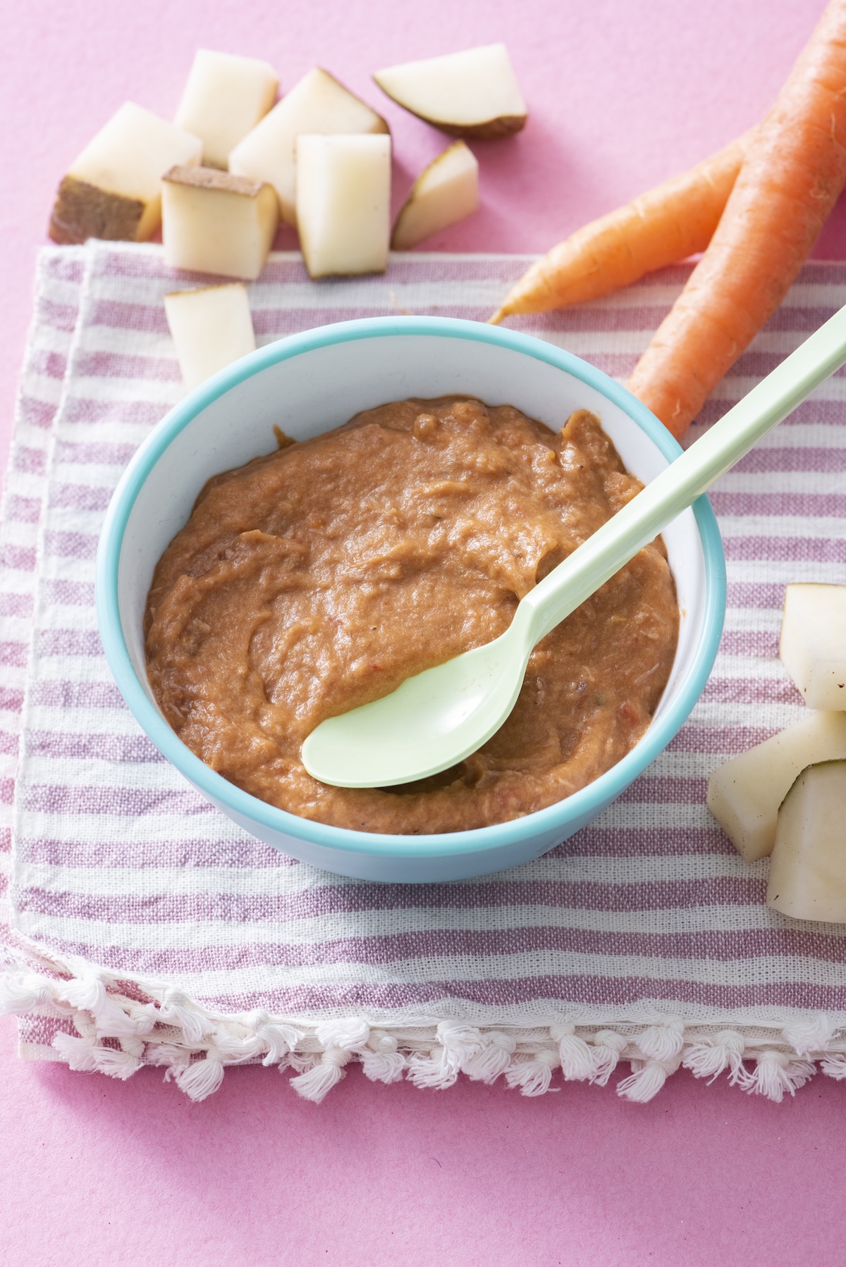 Baby beef stew in a blue bowl.