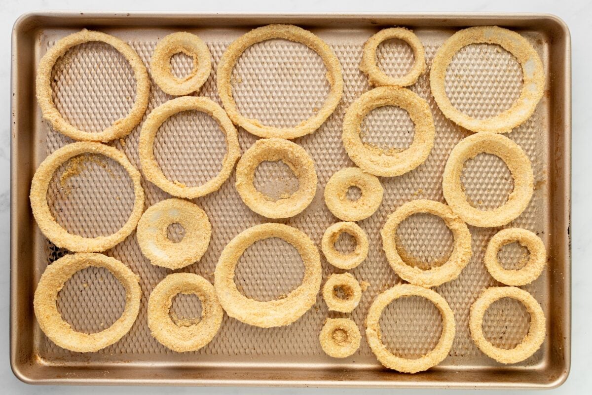 Breaded onion rings ready to bake.