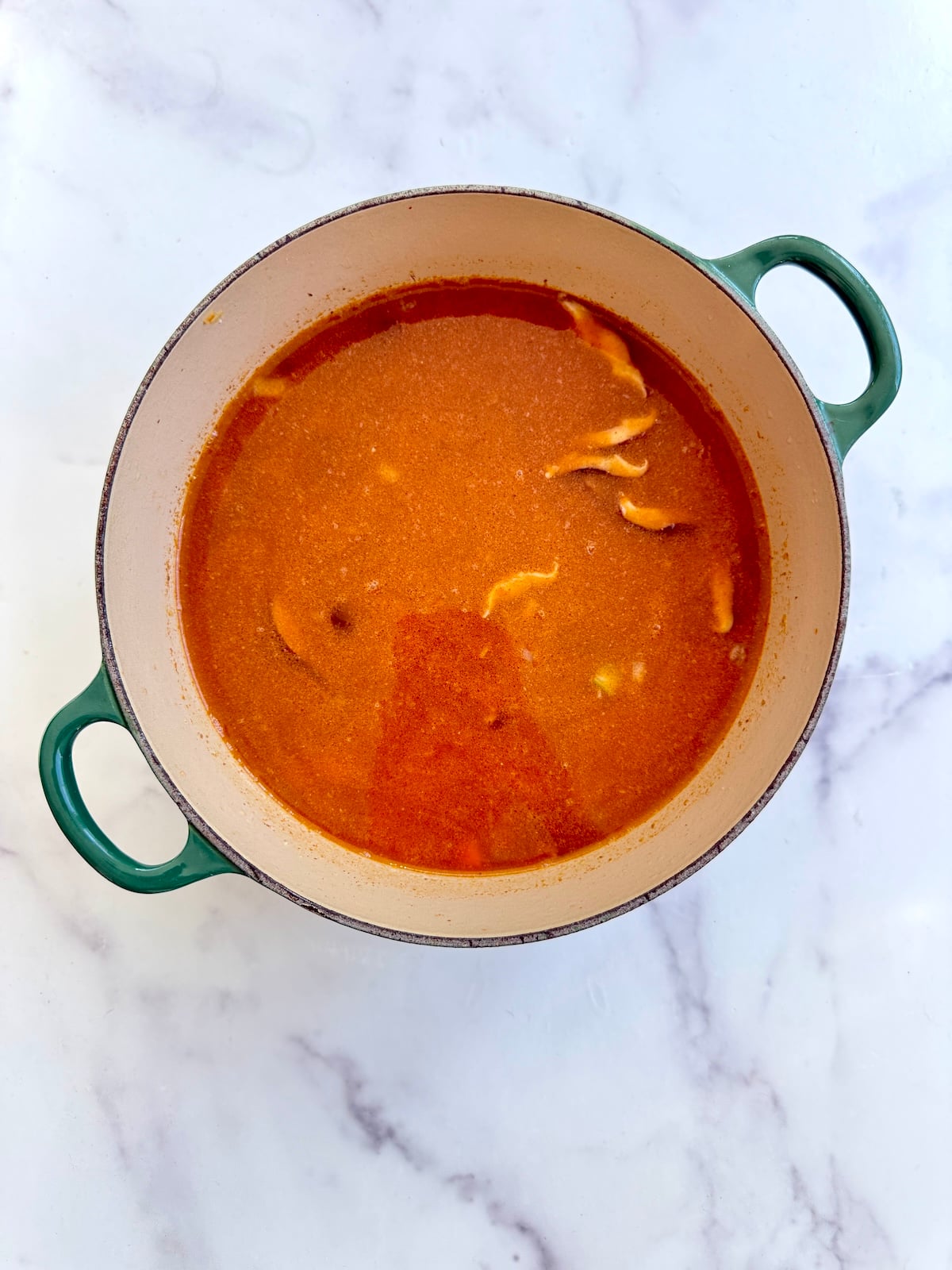 Smoky red lentil stew in a pot.
