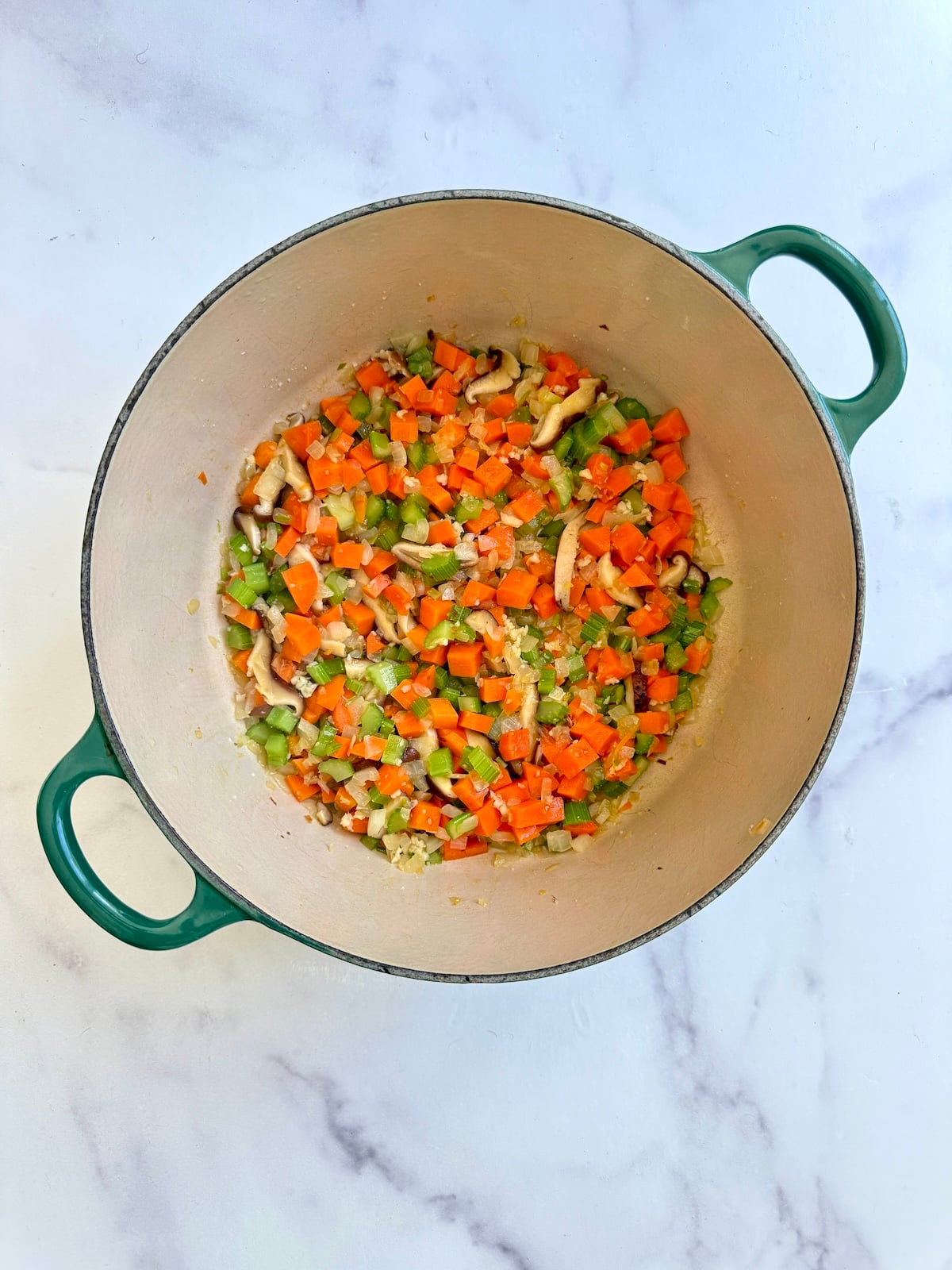 Sauteed vegetables in a pot.