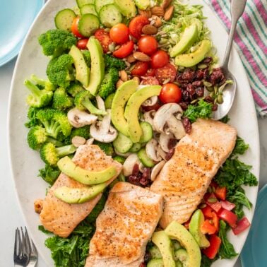Superfood salad with salmon on a large serving platter.