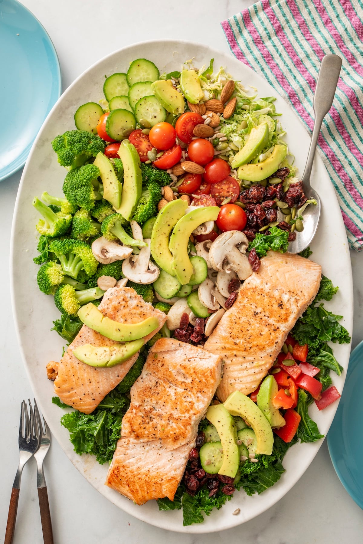 Superfood salad with salmon on a large serving platter.