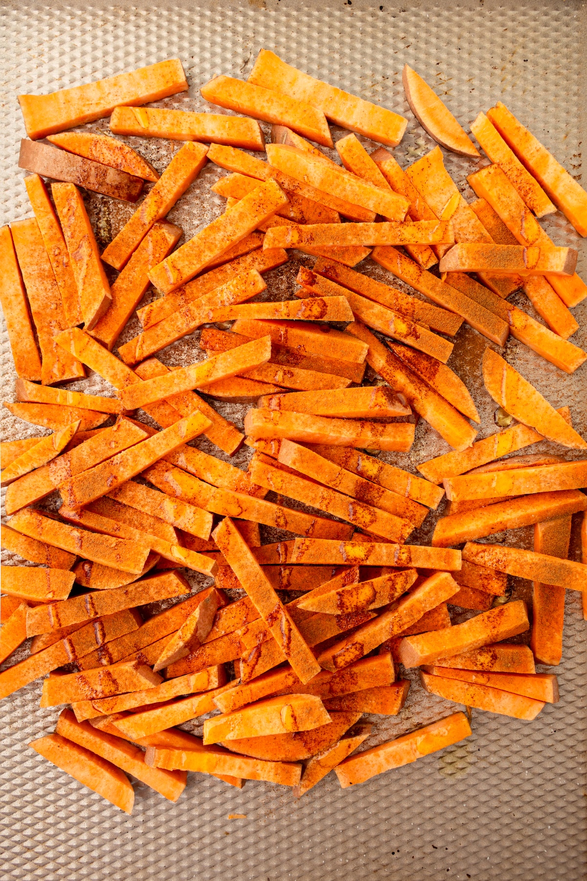 Sweet potato fries tossed with olive oil.
