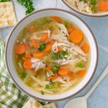 A bowl of chicken soup made in the pressure cooker.