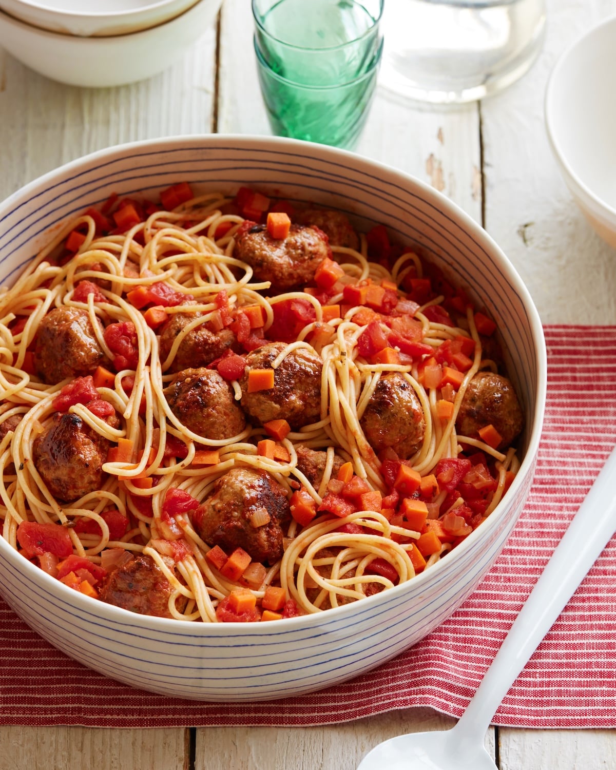 Spaghetti and turkey meatballs in a serving bowl.