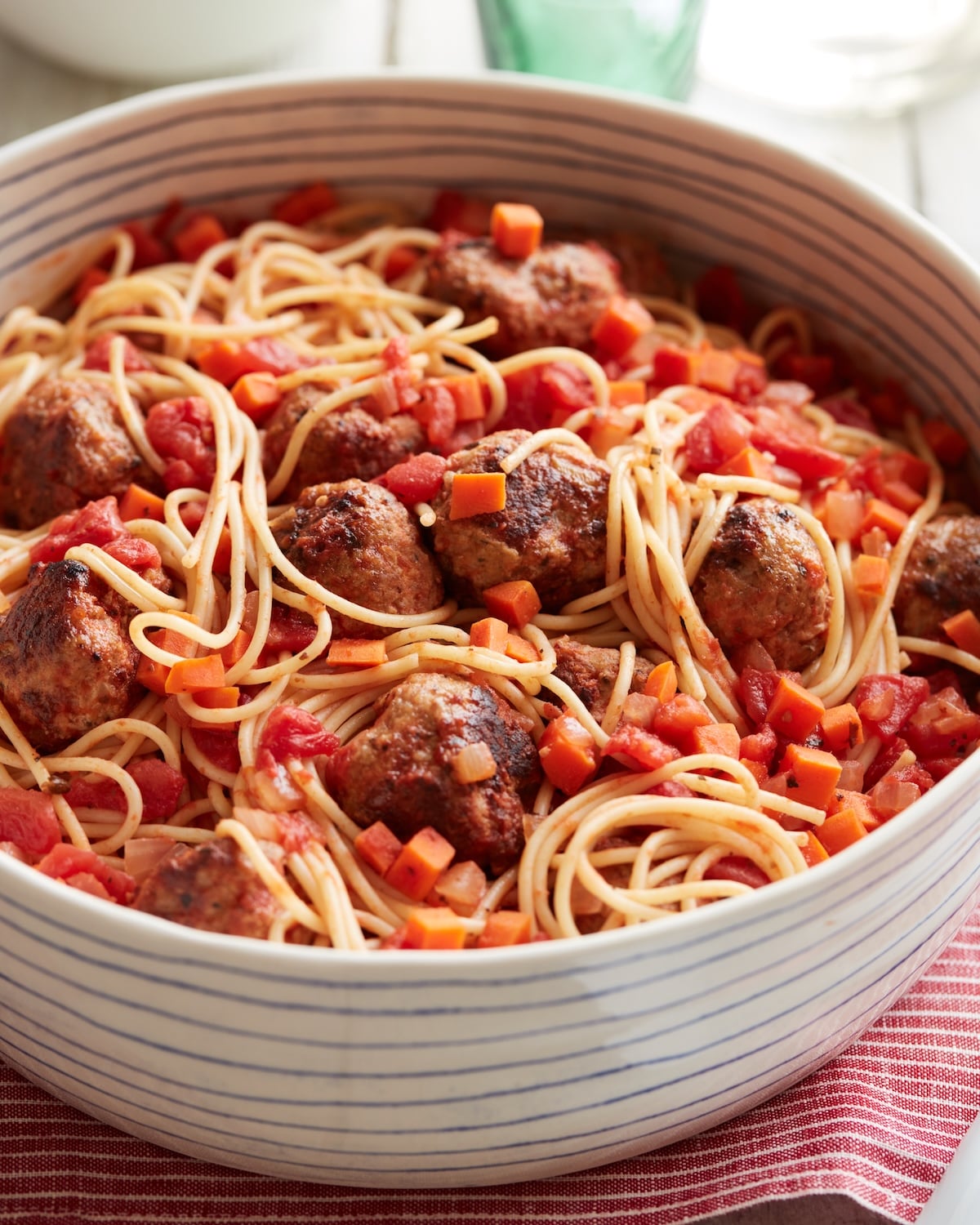 Spaghetti and turkey meatballs in a serving bowl.