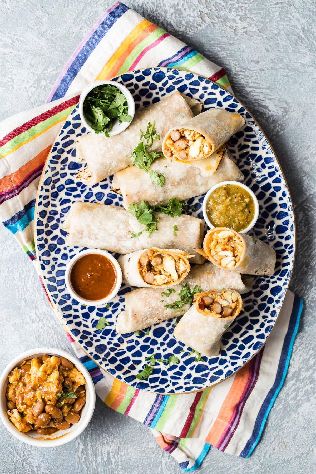 Breakfast burritos on a serving platter.