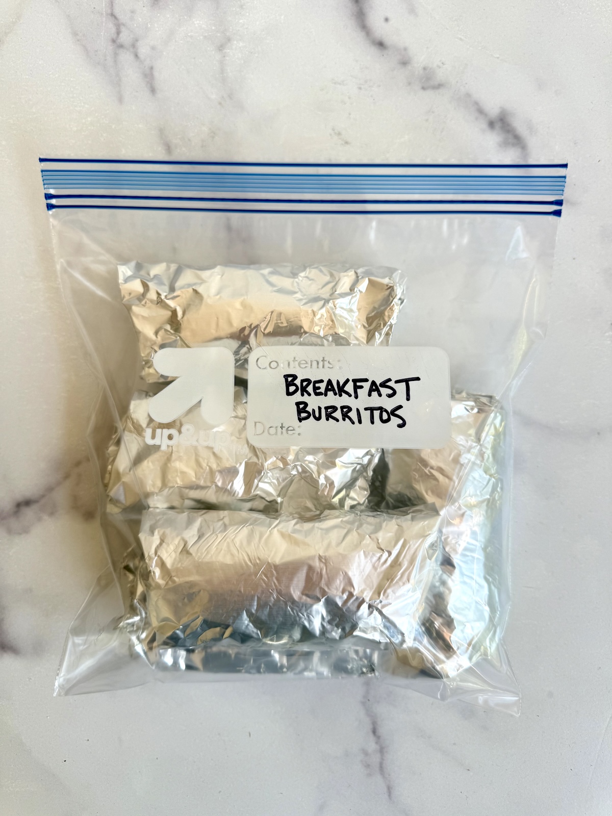 Make ahead breakfast burritos wrapped in foil and stored in a freezer bag.