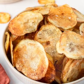 A bowl of homemade oven baked potato chips.