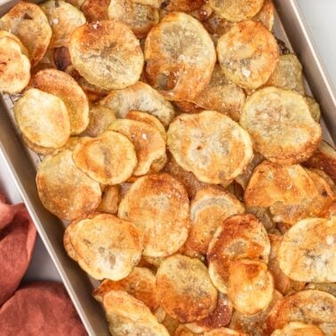 Baked potato chips on a sheet tray.